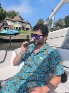 man in a blue decorative outfit using Mixturus dry herb vaporizer