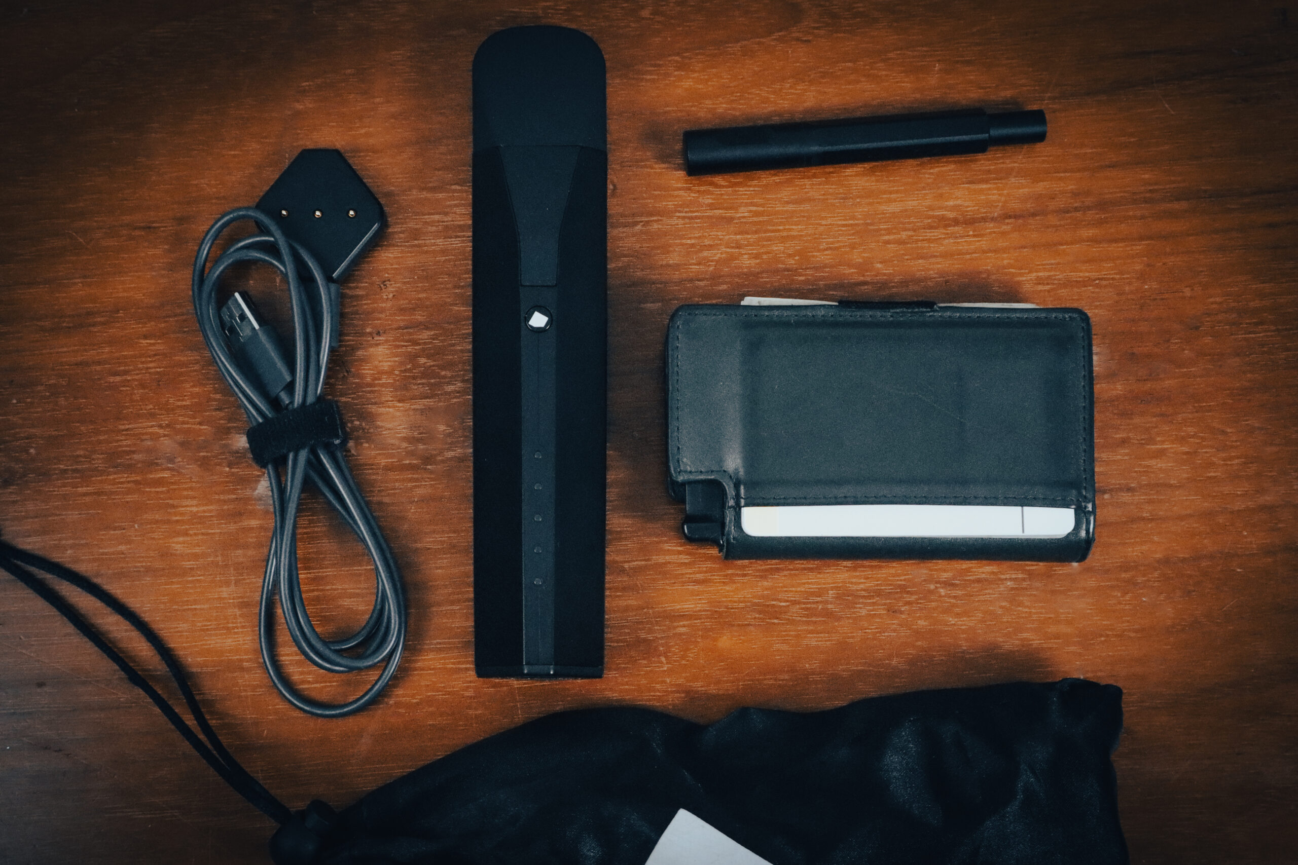 The Mixturus vaporizer with all three chamber attachments on warm wood